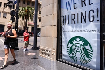 caption: A recruitment sign hangs at Starbucks in Los Angeles.