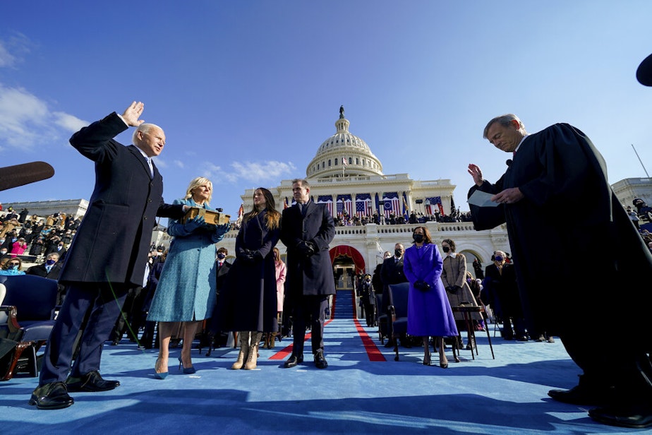 caption: Joe Biden is sworn in as the 46th president of the United States by Chief Justice John Roberts as Jill Biden holds the Bible during the 59th Presidential Inauguration at the U.S. Capitol in Washington, Wednesday, Jan. 20, 2021, as children Ashley and Hunter watch.