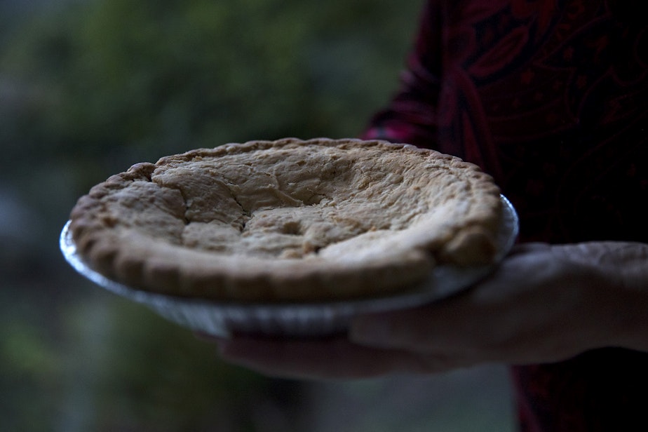 caption: Sheila Kelly holds a mincemeat pie bought by her mother, Helen May Kelly, in 1988, on Friday, November 22, 2019, at her home in Seattle. Her mother died before the pie could be consumed and she has kept it in her fridge for 31 years. 