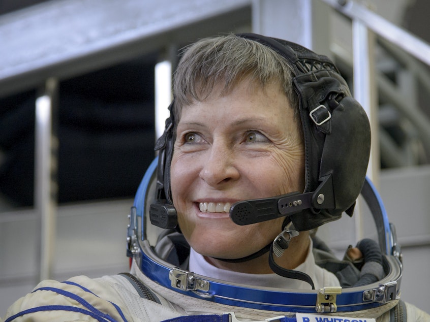 caption: Astronaut Peggy Whitson, probably thinking about breaking records or being in space.