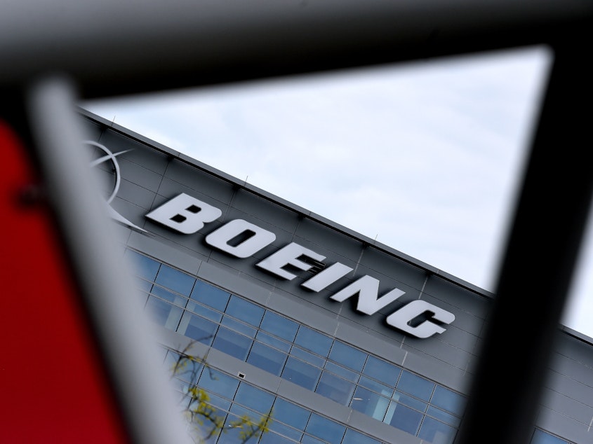 caption: The Boeing headquarters is seen amid the coronavirus pandemic on April 29, in Arlington, Va. Boeing announced sweeping cost-cutting measures Wednesday after reporting a first-quarter loss of $641 million following the hit to the airline business from the coronavirus pandemic.