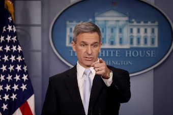 caption: Ken Cuccinelli, the acting director of U.S. Citizenship and Immigration Services, said Monday at the White House that immigrants legally in the U.S. may no longer be eligible for green cards if they use food stamps, Medicaid and other public benefits.