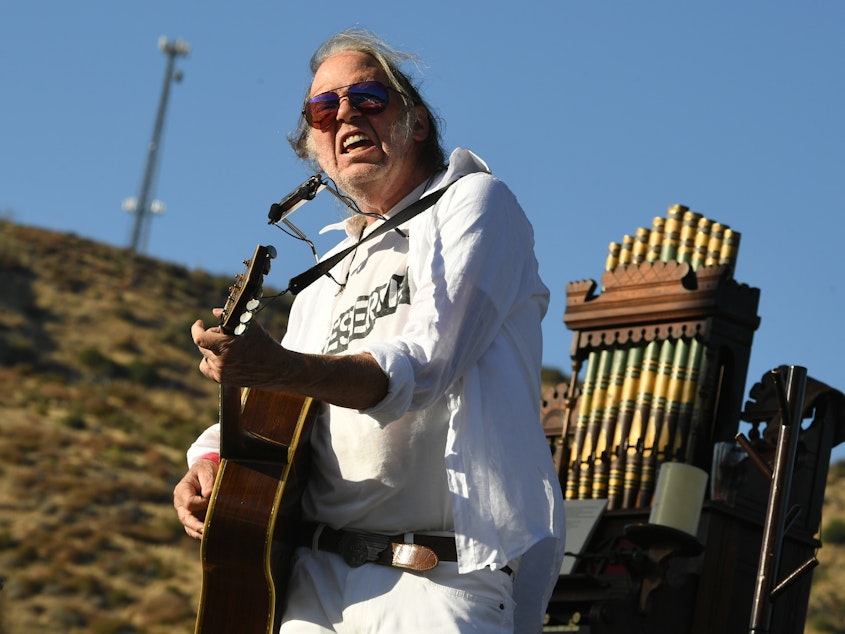 caption: Musician Neil Young, performing in Lake Hughes, Calif. last September.