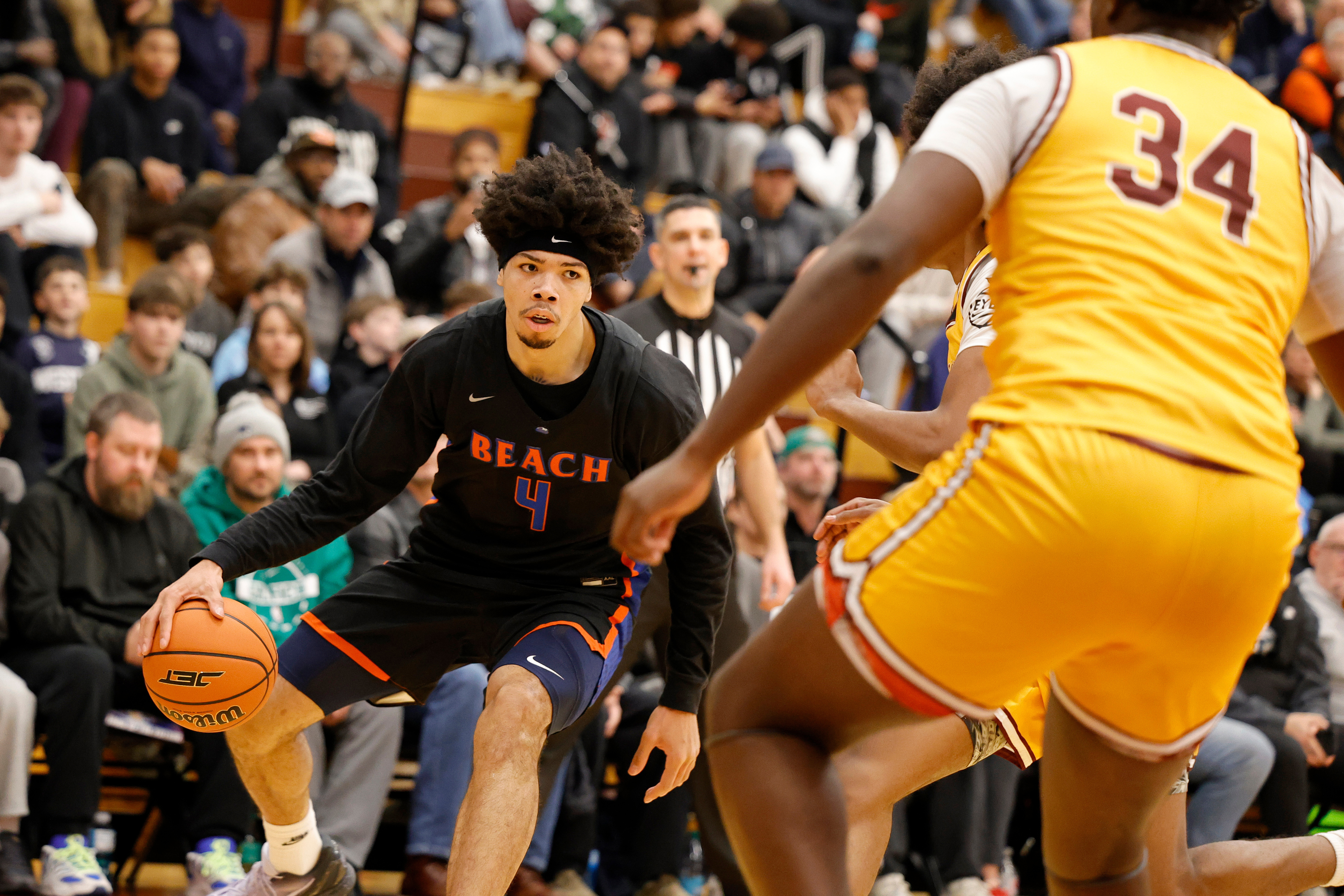 caption: Rainier Beach Tyran Stokes (4) in action against Bishop McNamara during a high school basketball game at the Hoophall Classic, Sunday, January 18, 2026, in Springfield, MA. 