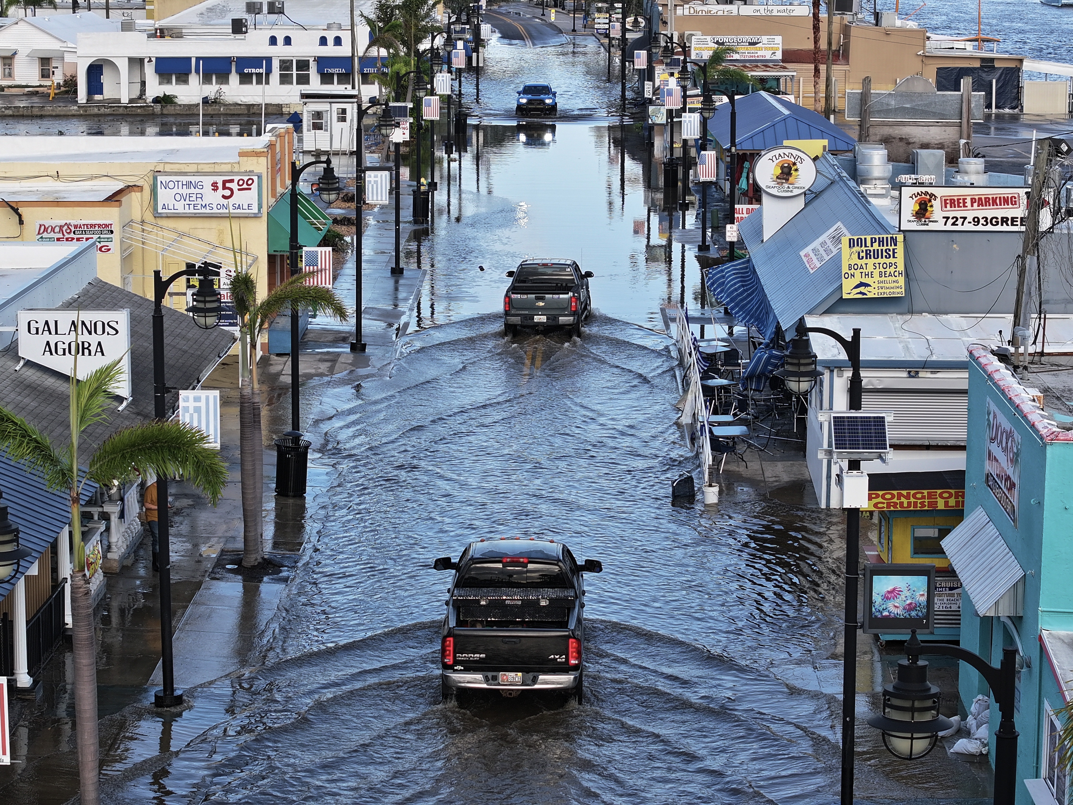 caption: Flood waters cover the main streets of Tarpon Springs, Florida after Hurricane Helene passed offshore on September 27, 2024 . (Photo by Joe Raedle/Getty Images)