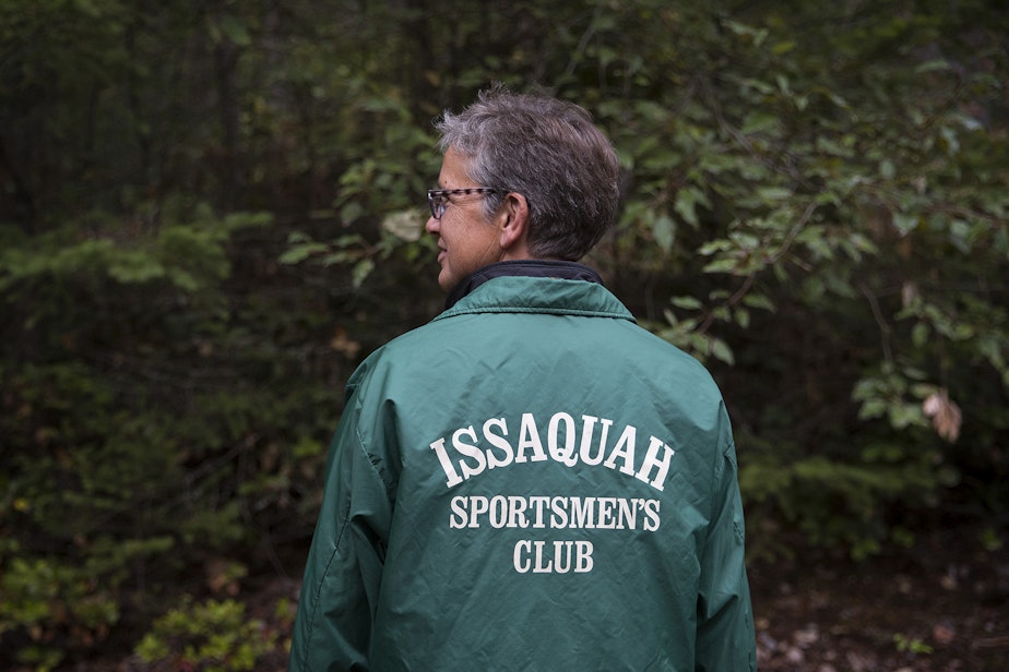 caption: Julie Watkins-Jarvies poses for a portrait wearing her father Walt. S. Watkin's jacket on Monday, September 10, 2018, at the Sportmen's Club in Issaquah.