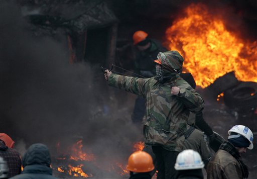 caption: Protests in Ukraine have led to the resignation of the prime minister and the deaths of at least five people.