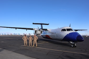 caption: The Universal Hydrogen flight test crew posed for pictures after a successful first flight of the company's hydrogen-electric Dash 8 airliner on March 2, 2023.