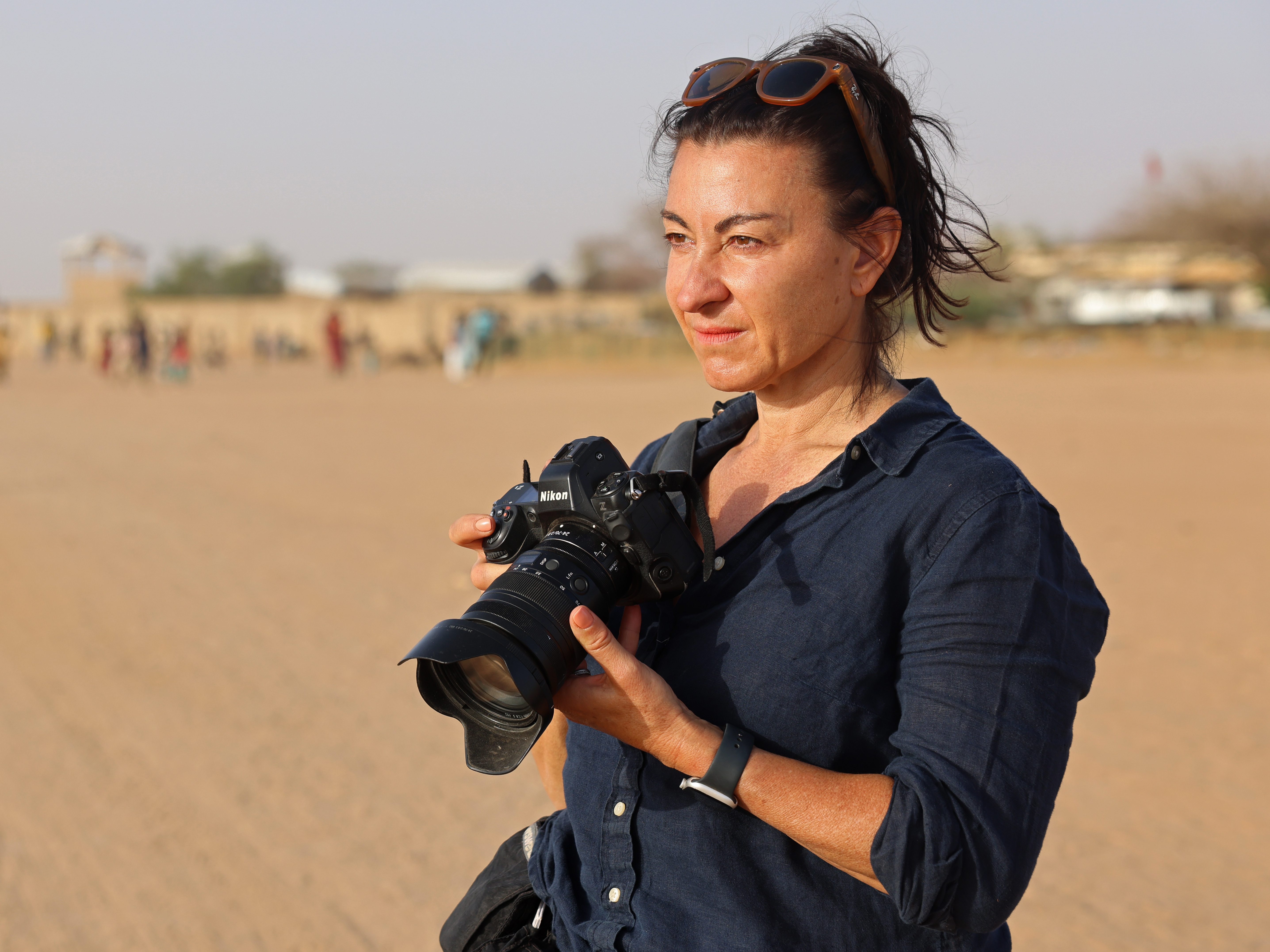 caption: Lynsey Addario on assignment in Iridimi Refugee Camp, in Wadi Fira, Chad.