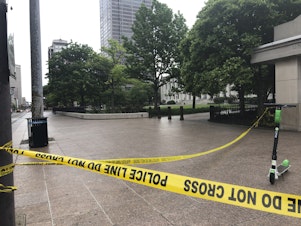 caption: Police tape marks a corner of the Ohio Statehouse in Columbus last May after protests over the death of George Floyd. Columbus police are investigating the shooting death of a Black man last week by a Franklin County sheriff's deputy.