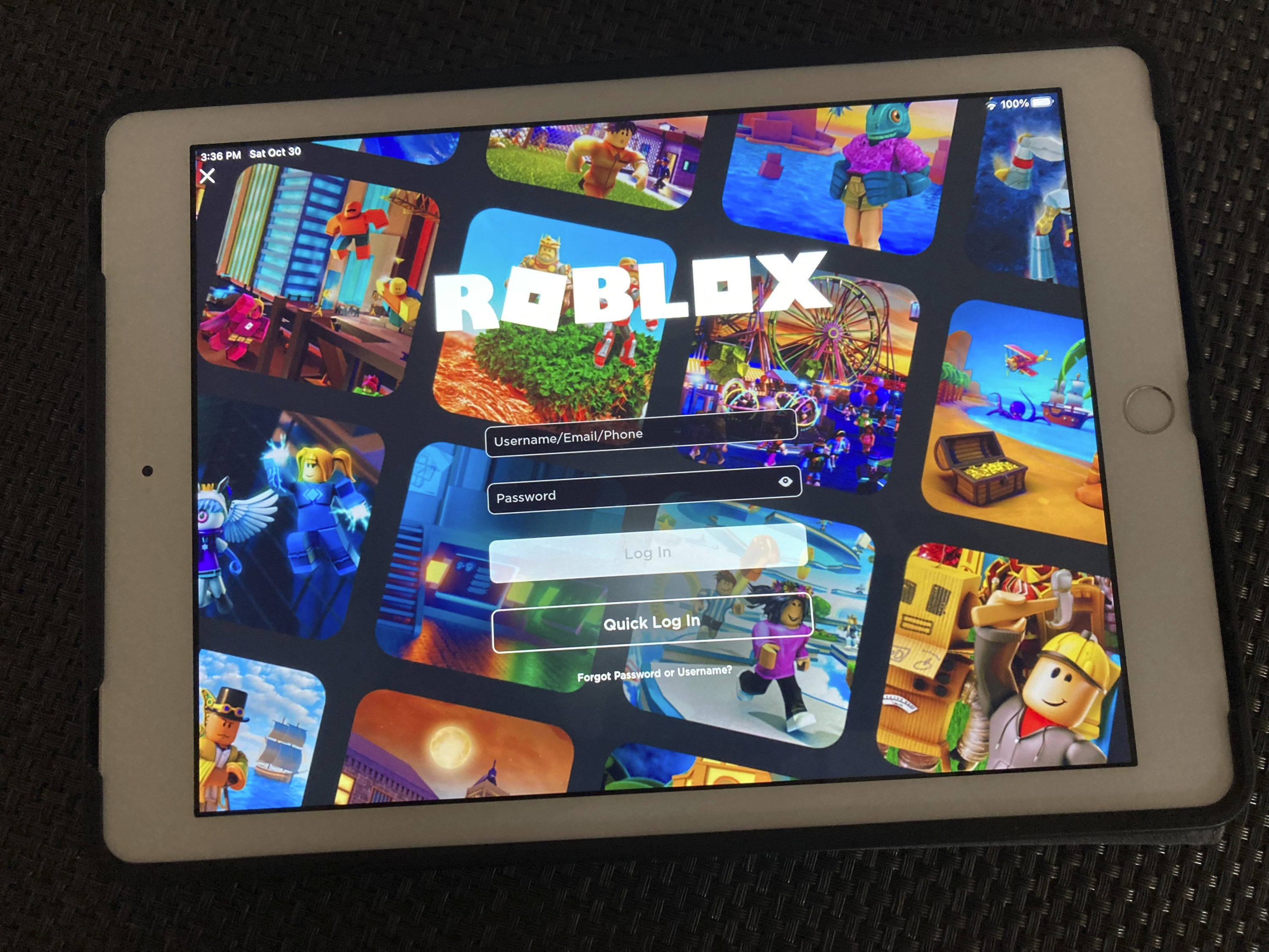 caption: The gaming platform Roblox is displayed on a table. (Leon Keith/AP)