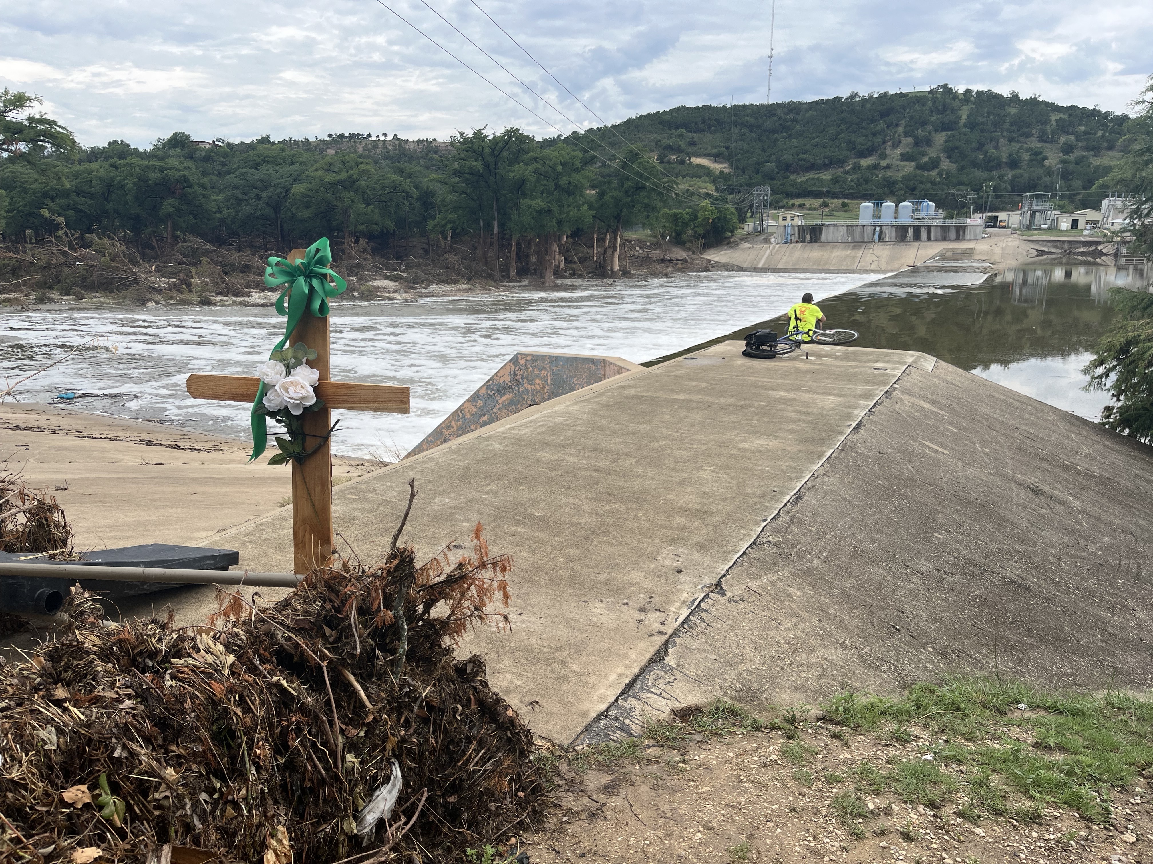 caption: The dam on the Guadalupe River that forms Nimitz Lake, the city of Kerrville's primary water reservoir. County commissioners say they have a plan to drain at least one of the artificial reservoirs along the river, to facilitate the search for human remains and hazardous debris following the flash flood of July 4.