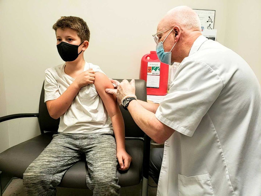 caption: 10-year-old Calvin says he was relieved that the needle wasn't nearly as big as friends from school said it would be. Monday, November 8, 2021.