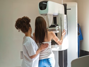 caption: The new guidelines were prompted by increased rates of breast cancer in women in their 40s. They recommend mammograms every other year, starting at age 40.