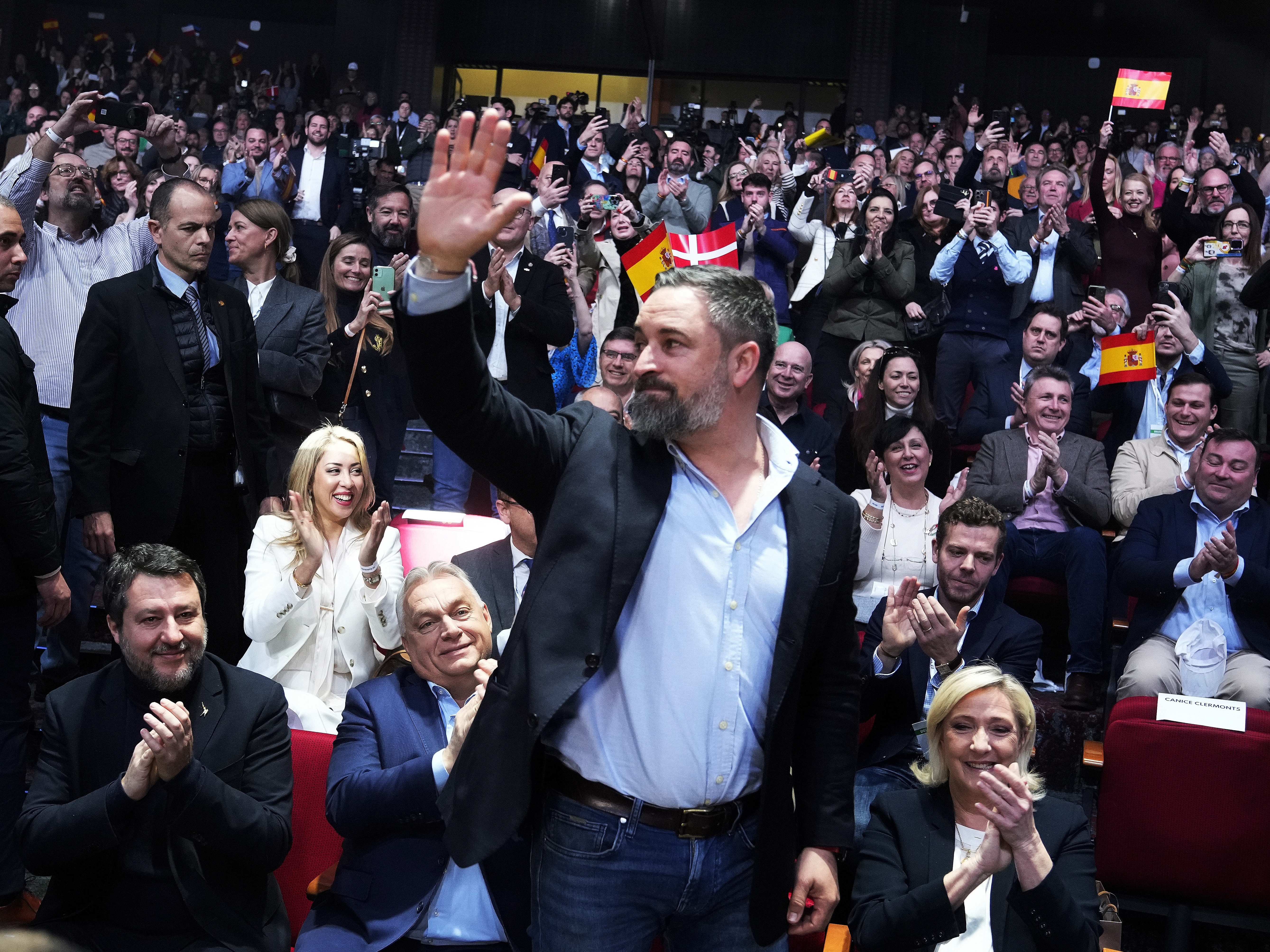 caption: Spanish far-right VOX party leader Santiago Abascal, centre, waves next to European far-right politicians during the Patriots for Europe summit in Madrid, Spain, Saturday, Feb. 8, 2025. From left, Italy's vice Premier Matteo Salvini, Hungarian Prime Minister Viktor Orban, far-right VOX party leader Santiago Abascal and French far-right leader Marine Le Pen.
