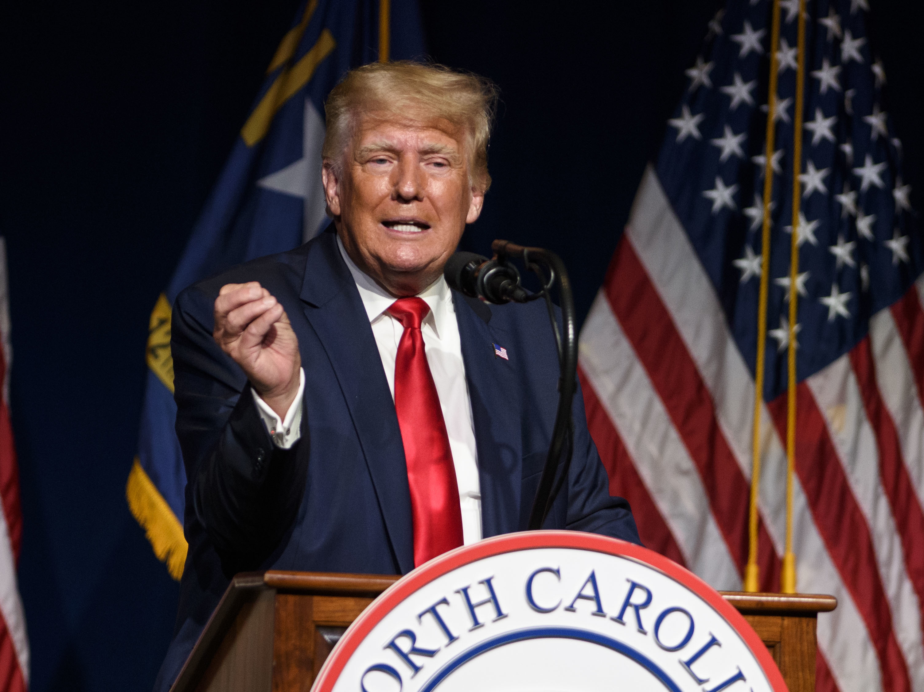 caption: Former President Donald Trump is seen here addressing the NCGOP convention on June 5.
