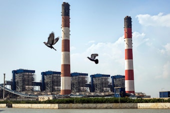 caption: The coal-fired Tata Mundra power plant in western India was funded by a branch of the World Bank. A group of farmers and fishermen are suing, claiming that contamination of local water sources has disrupted their livelihoods.