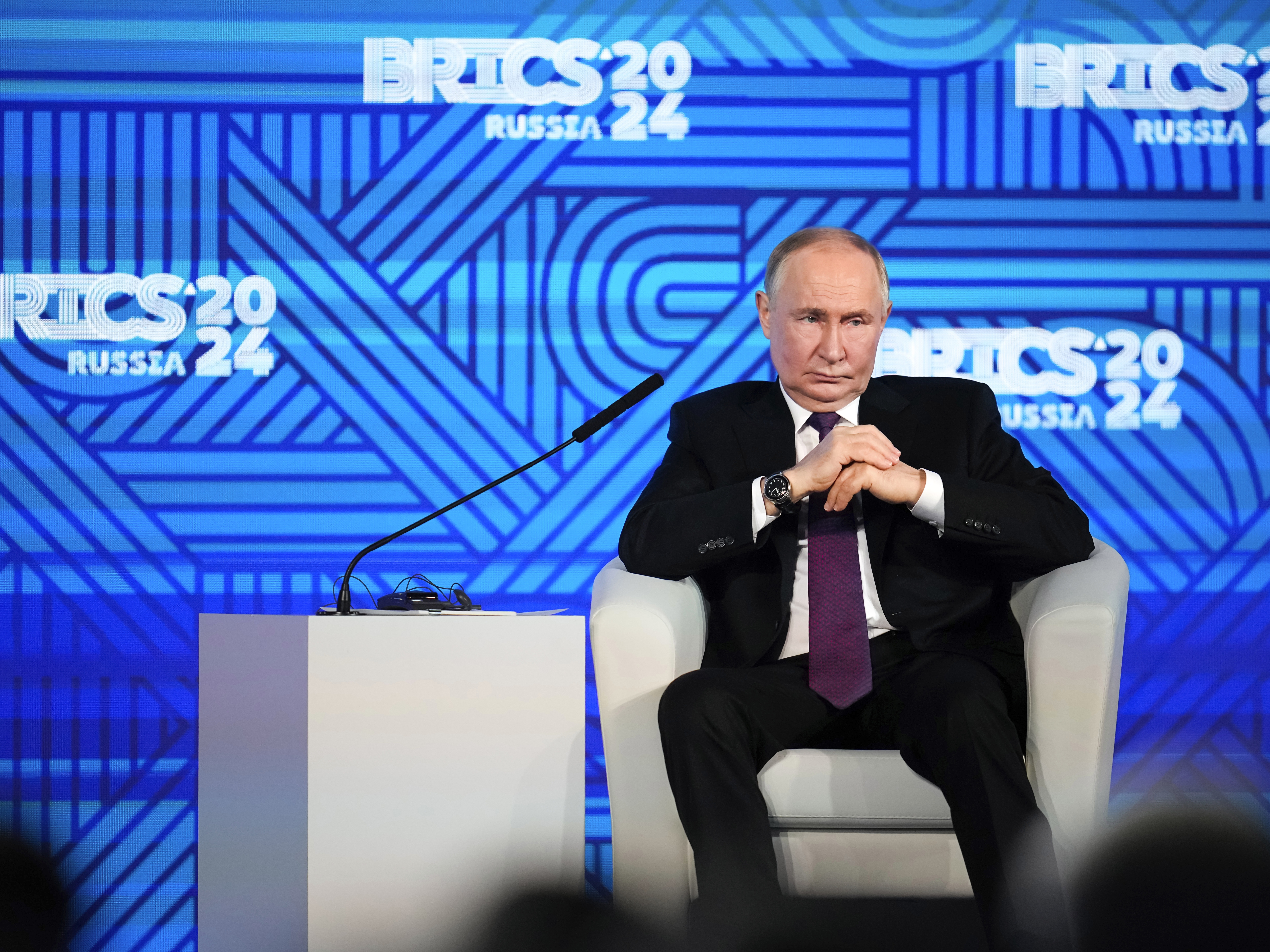 caption: Russian President Vladimir Putin attends the BRICS business forum in Moscow, Russia, on Oct. 18, 2024.