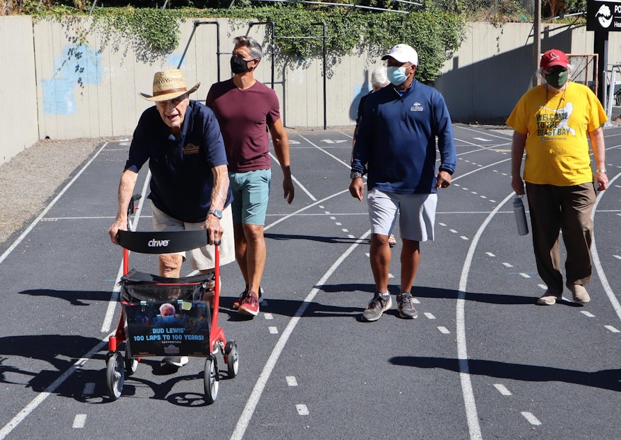 caption: World War II veteran Bud Lewis logged more laps of the Duniway Park track with supporters on Aug. 27, 2020.