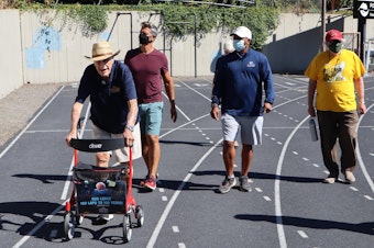 caption: World War II veteran Bud Lewis logged more laps of the Duniway Park track with supporters on Aug. 27, 2020.