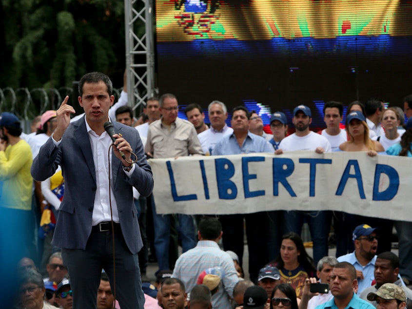 caption: Venezuelan opposition leader Juan Guaidó speaks to supporters in Caracas on Saturday.