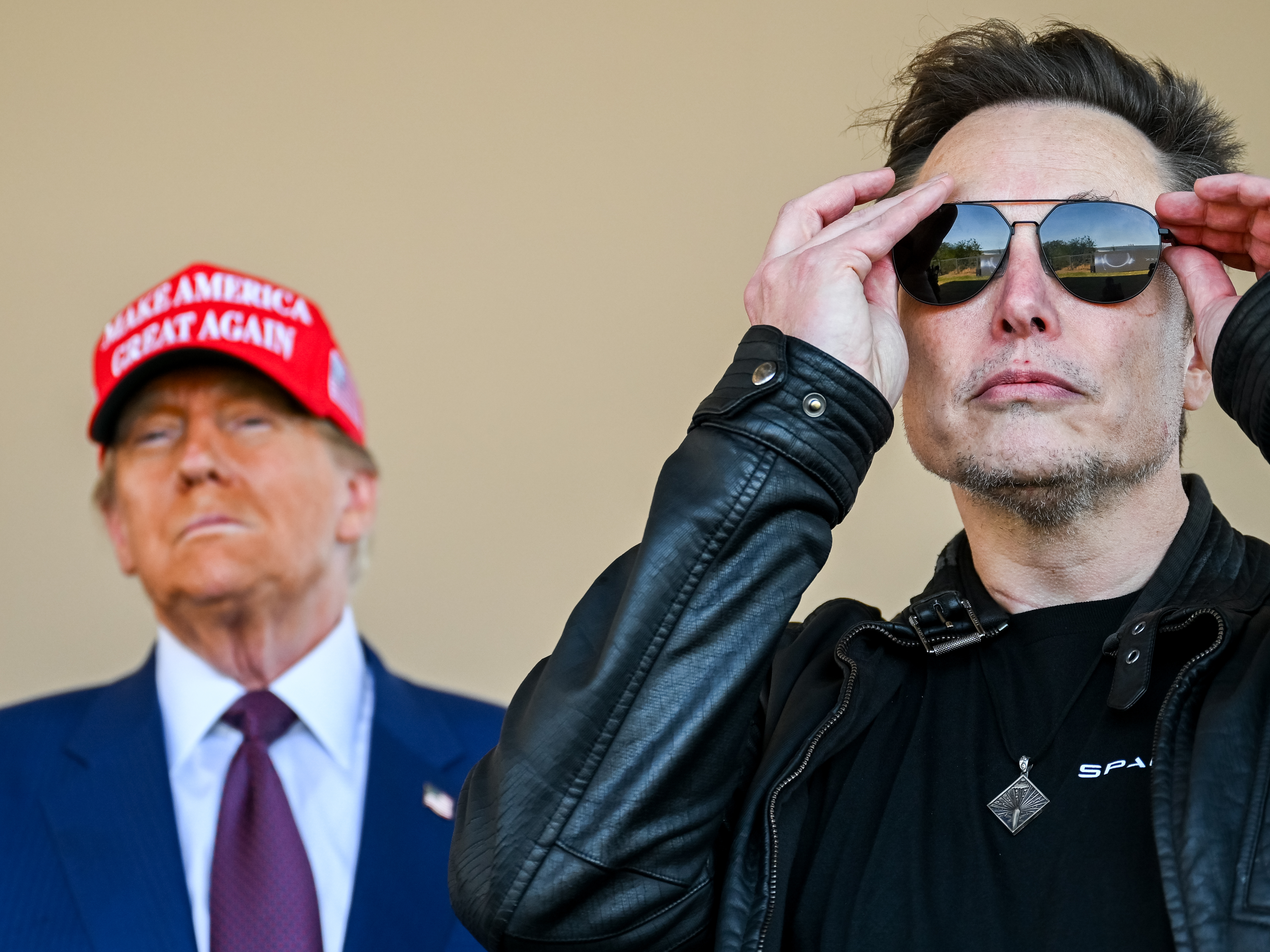 caption: U.S. President-elect Donald Trump and Elon Musk watch the launch of the sixth test flight of the SpaceX Starship rocket on November 19, 2024 in Brownsville, Texas.