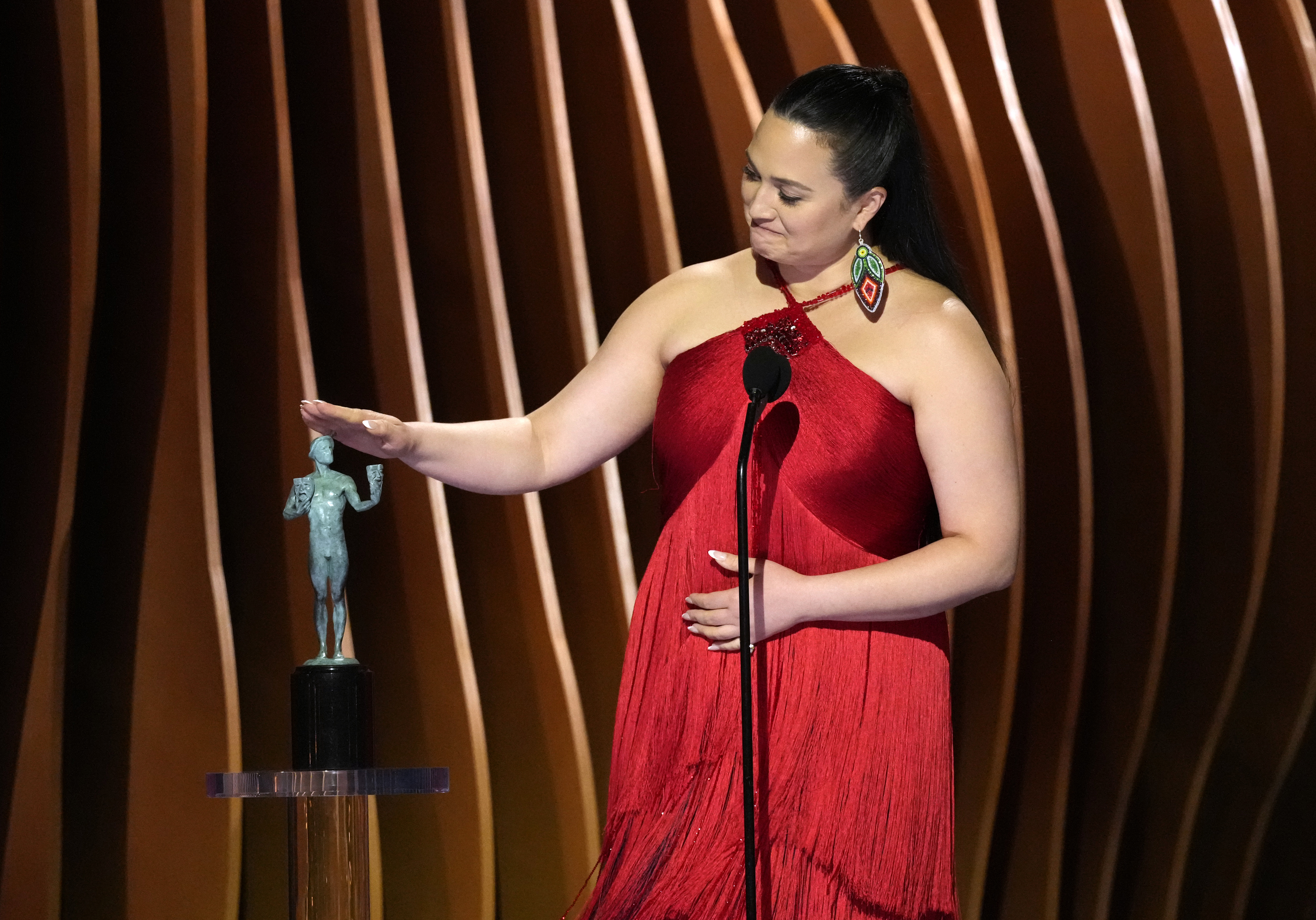 caption: Lily Gladstone accepts the award for outstanding performance by a female actor in a leading role for "Killers of the Flower Moon" during the 30th annual Screen Actors Guild Awards on Saturday, Feb. 24, 2024, at the Shrine Auditorium in Los Angeles. 
