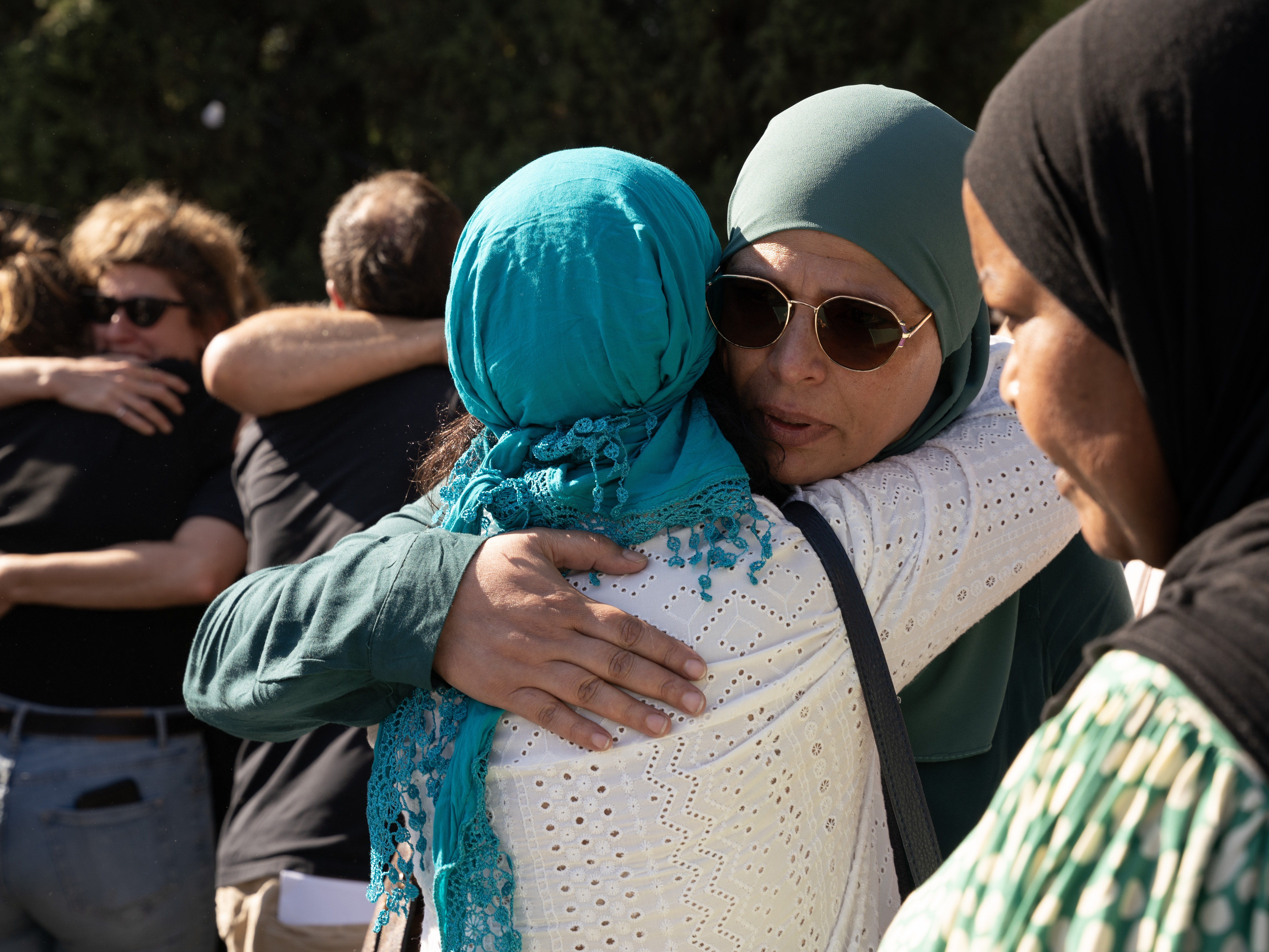 caption: Hundreds of mourners gather for the funeral service of Canadian Israeli peace activist Vivian Silver on Thursday in Kibbutz Gezer, Israel.