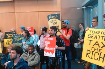 caption: People pack Seattle City Hall in June, 2017 for a meeting about whether to enact an income tax.
