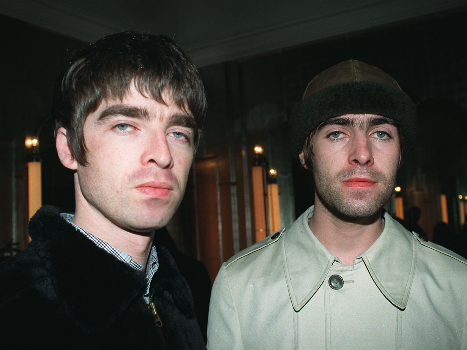 caption: Liam (right) and Noel Gallagher, pictured in London in February 1999, were members of the beloved band Oasis from 1991 until it broke up in 2009. 
