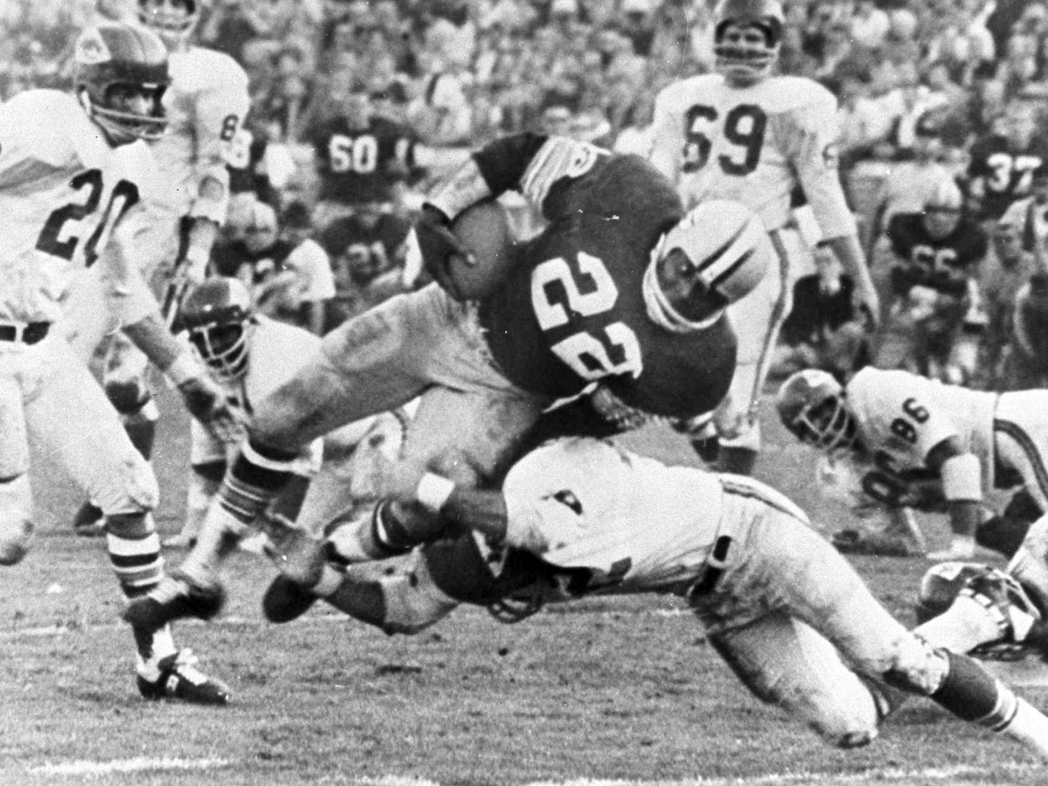 caption: In this Jan. 15, 1967, file photo, Green Bay Packers' Elijah Pitts (22) goes over right tackle to the Kansas City Chiefs' five-yard line, for a six-yard gain before being brought down by Kansas City's Johnny Robinson in the fourth quarter of Super Bowl I in Los Angeles.