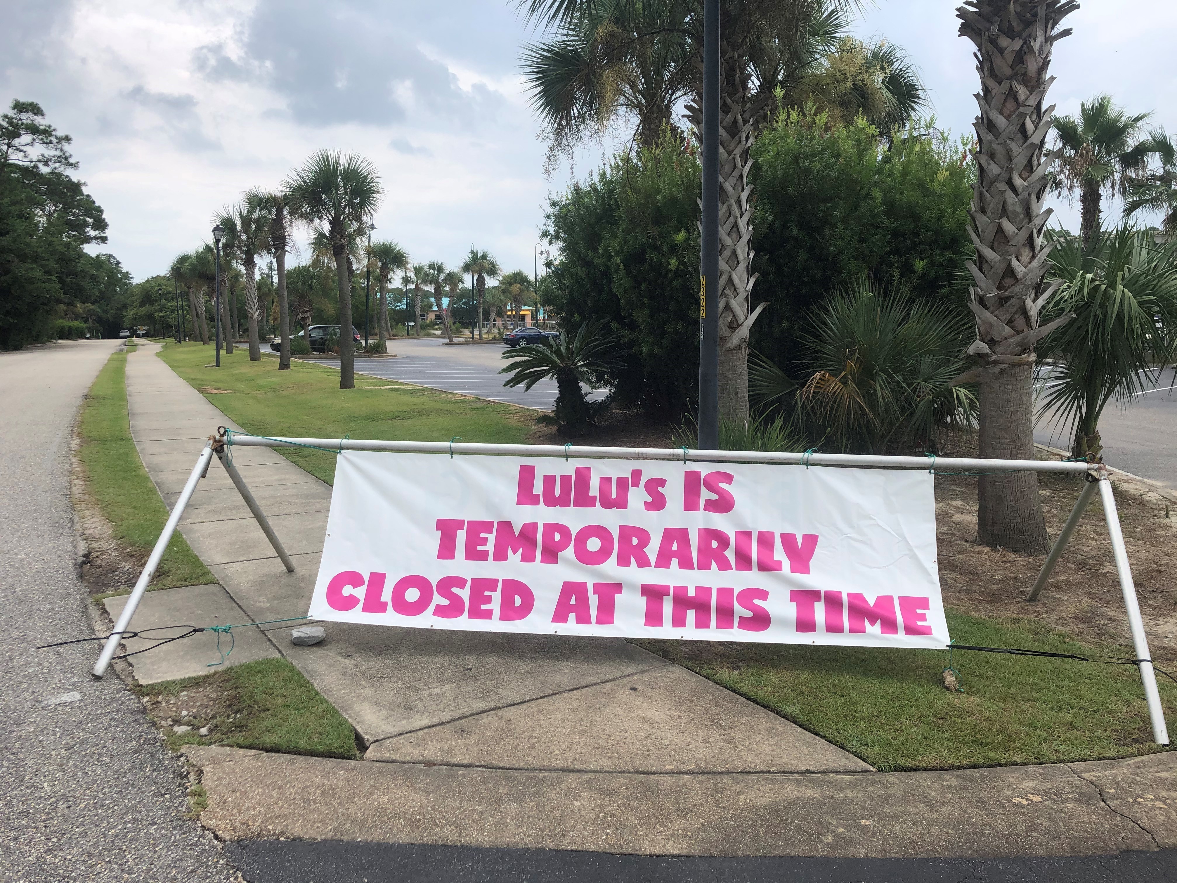 caption: Lulu's restaurant in Gulf Shores, Ala., closed temporarily after COVID-19 infections were "racing among our staff," according to owner Lucy Buffett in a Facebook post. "Folks this is serious business," she says. "We are taking a pause to evaluate the best way to navigate this next phase of COVID."