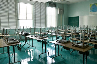 caption: An empty classroom is seen at Hollywood High School on August 13, 2020 in Hollywood, California. (Rodin Eckenroth/Getty Images)