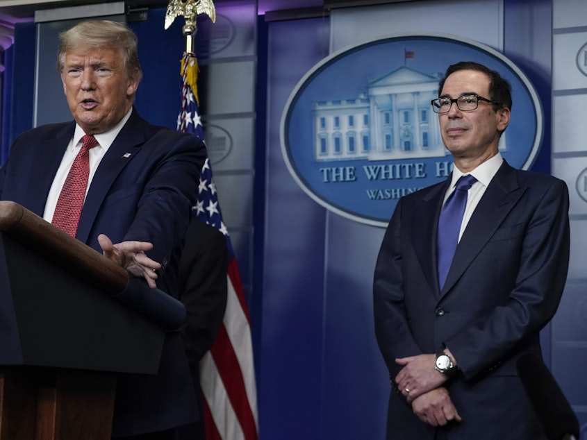 caption: Treasury Secretary Steven Mnuchin previously estimated that payments to qualifying Americans would go out by mid-April.