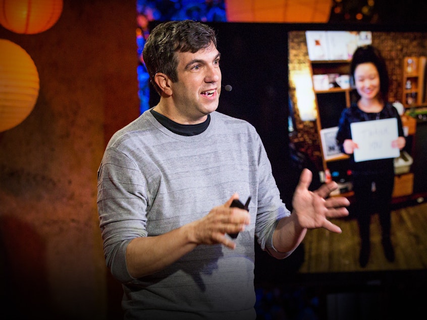 caption: AJ Jacobs on the TED stage.