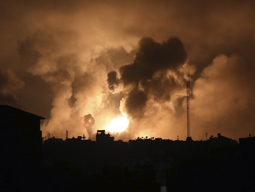 caption: Explosions caused by Israeli airstrikes in the northern Gaza Strip, on Friday.