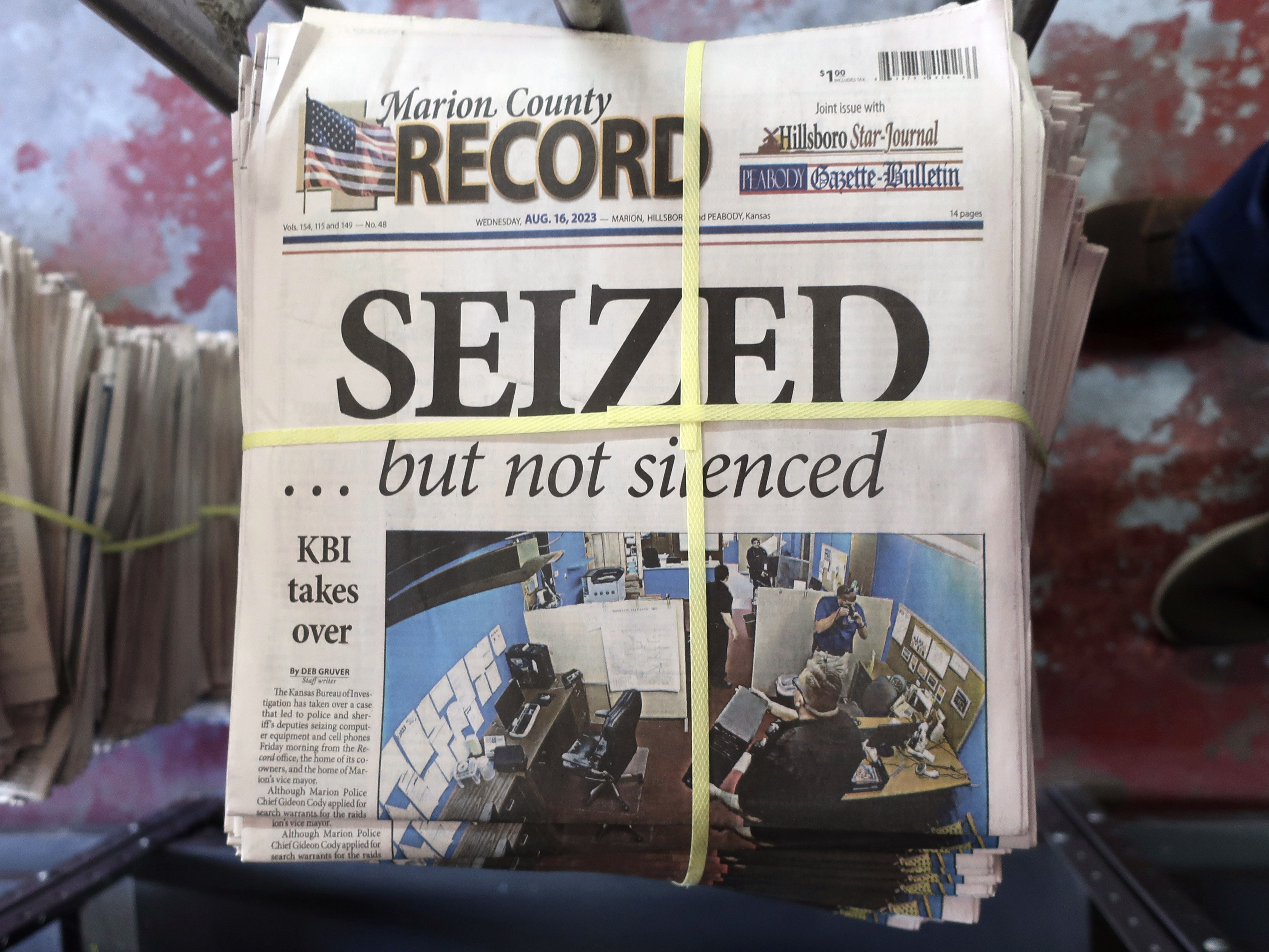 caption: A stack of the Marion County Record sits in the back of the newspaper's building, awaiting unbundling, sorting and distribution, Aug. 16, 2023, in Marion, Kan. Two special prosecutors said on Monday that they plan to file a criminal obstruction of justice charge against a former central Kansas police chief over his conduct following a raid last year on his town's newspaper, and that the newspaper's staff committed no crimes.