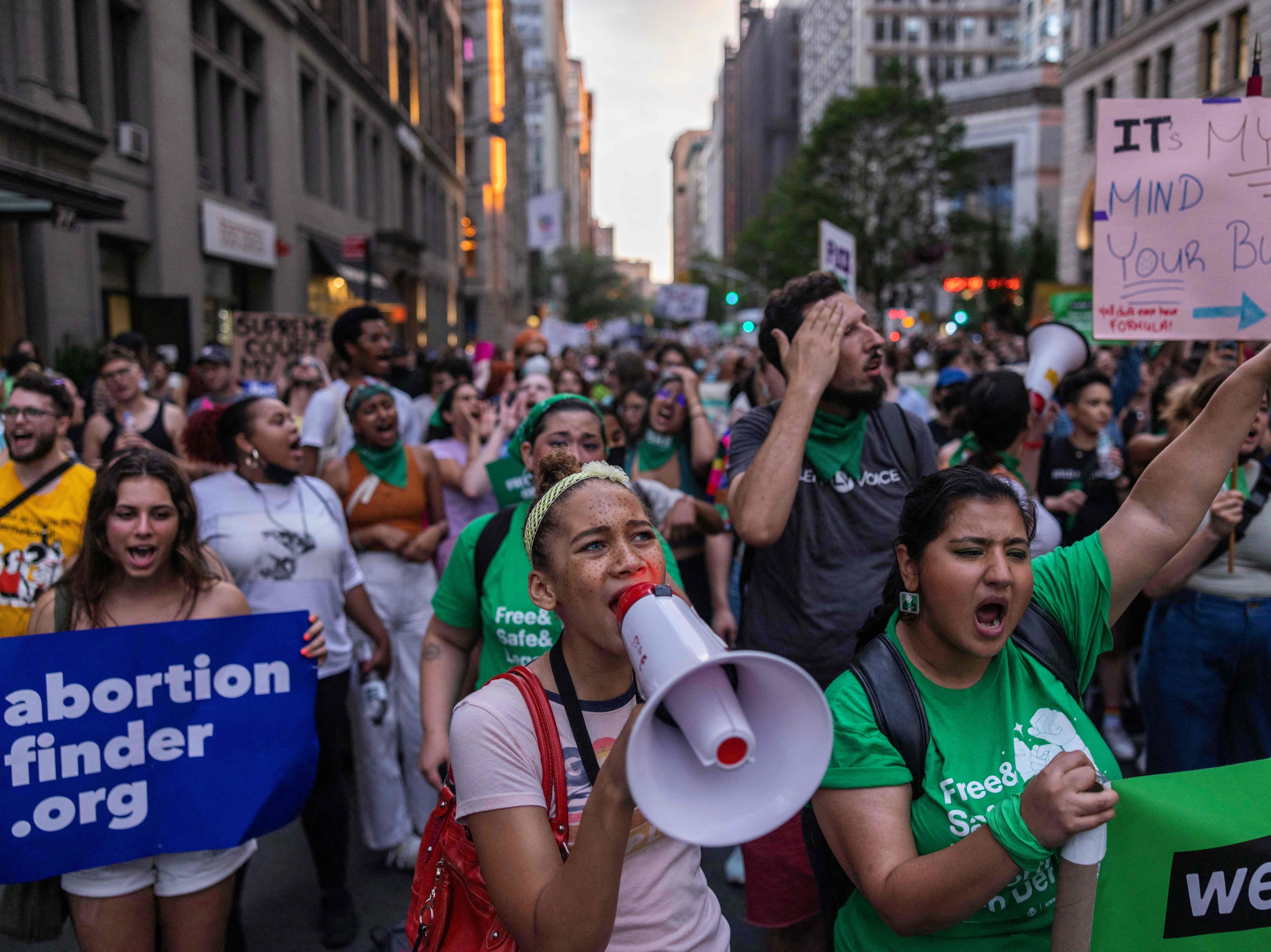 caption: Abortion rights activists march from Washington Square Park to Bryant Park in protest of the overturning of Roe v. Wade by the U.S. Supreme Court. The march was in New York on June 24, 2022.