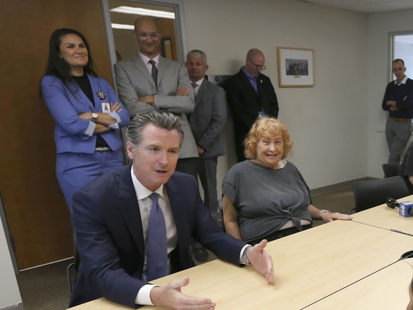caption: Gov. Gavin Newsom (left) talks with members of a Diabetes Talking Circle during his visit to the Sacramento Native American Health Center in Sacramento, Calif., on Tuesday.