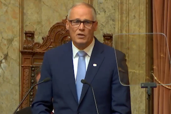caption: Washington Gov. Jay Inslee delivers his annual State-of-the-State address, Jan. 10, 2023.