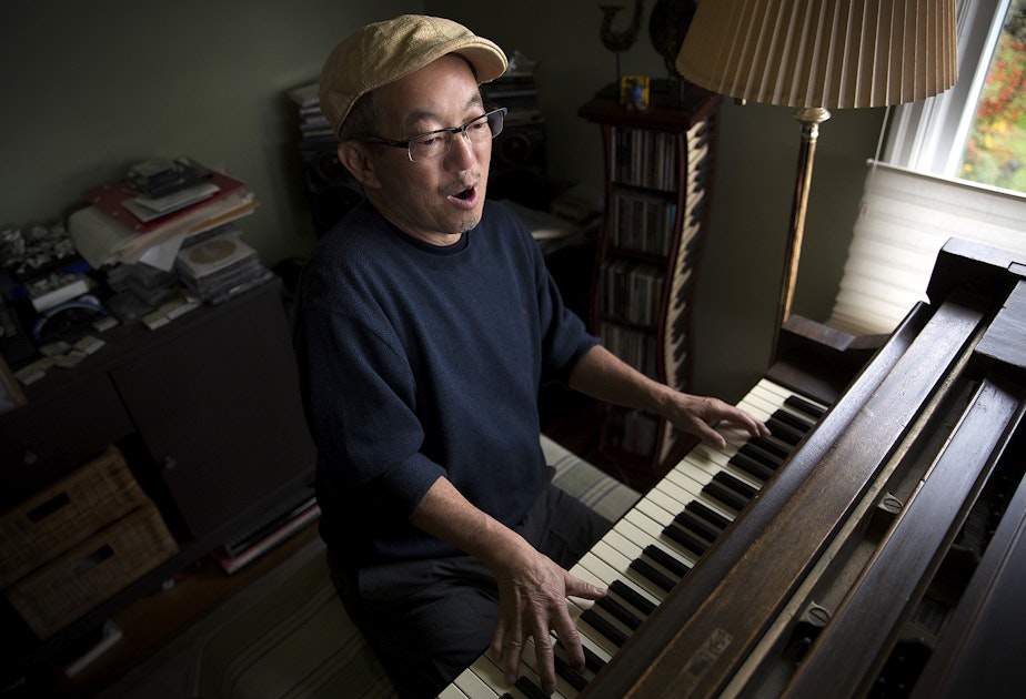 caption: Deems Tsutakawa, the third of George and Ayame Tsutakawa's four children, plays his grand piano on Tuesday, November 28, 2017, at his home in Seattle.