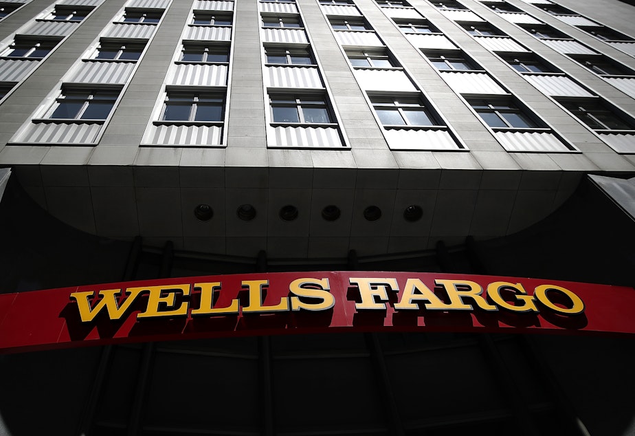 caption: Wells Fargo announced that employees who have been working remotely for nearly two years will return to the office on March 14, 2022, on a flexible hybrid schedule.