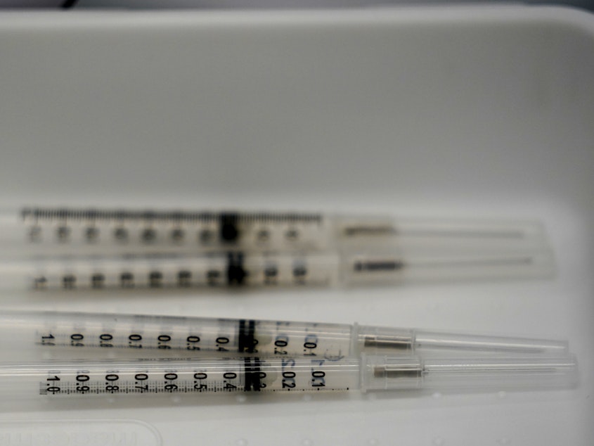 caption: Syringes filled with the Pfizer-BioNTech COVID-19 vaccine are shown in April at the Christine E. Lynn Rehabilitation Center in Miami.