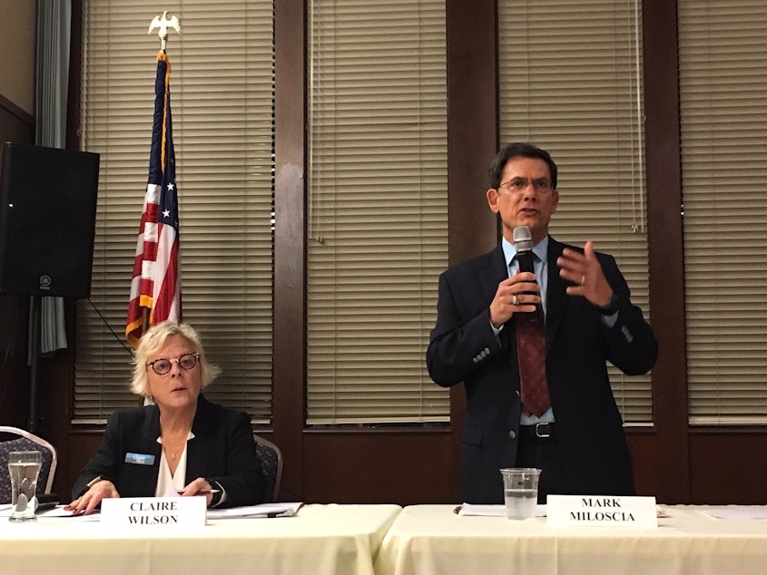 caption: Republican state Senator Mark Miloscia speaks at a candidate's forum in Federal Way as his opponent Claire Wilson awaits her turn to respond.