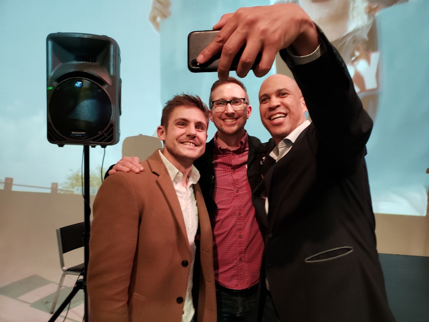 caption: Democratic candidate Cory Booker promised a selfie to every donor at Seattle fundraiser on Tuesday, December 17, 2019.