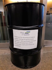 caption: The Port of Seattle setup this barrel last week after passengers asked how they could help federal employees working without pay during the government shutdown.