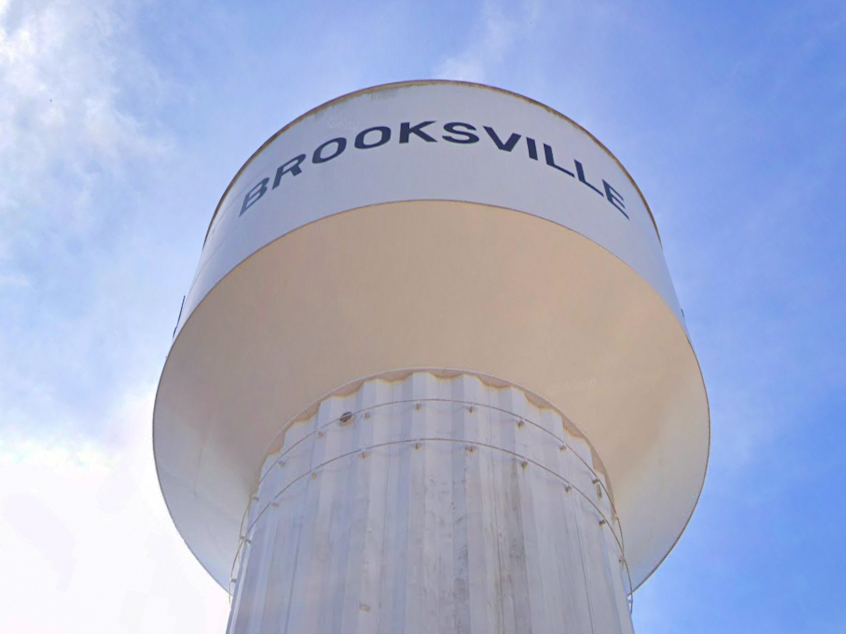 caption: The Brooksville water tower was accidentally sold by the city to a businessman who was trying to buy a municipal building at the tower's base.