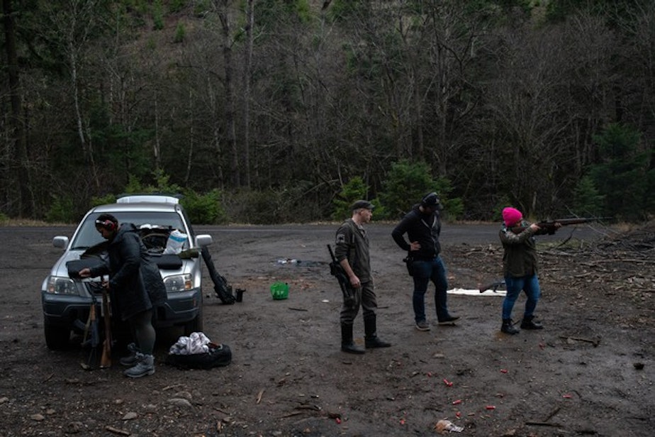 caption: <p>Ross Eliot (center, left) and Rosie Strange (right) take target practice with other activists on Feb. 2, 2019 in Hood River, Ore.</p>