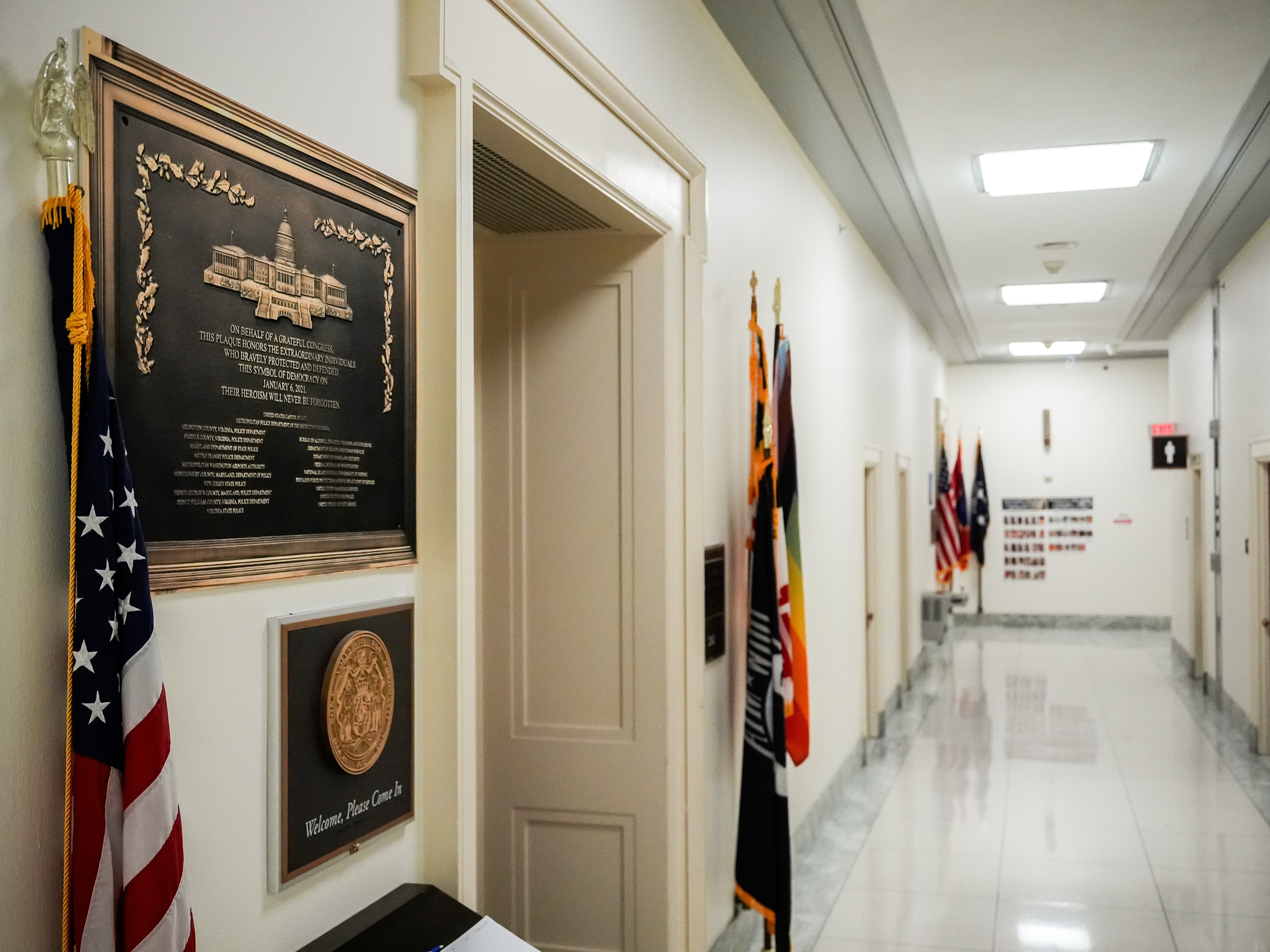 caption: A replica plaque commemorating the Jan. 6, 2021 Capitol riot hangs outside the office of Rep. Jamie Raskin, D-Md., Tuesday, Dec. 30, 2025, at the Rayburn House Office Building on Capitol Hill in Washington.