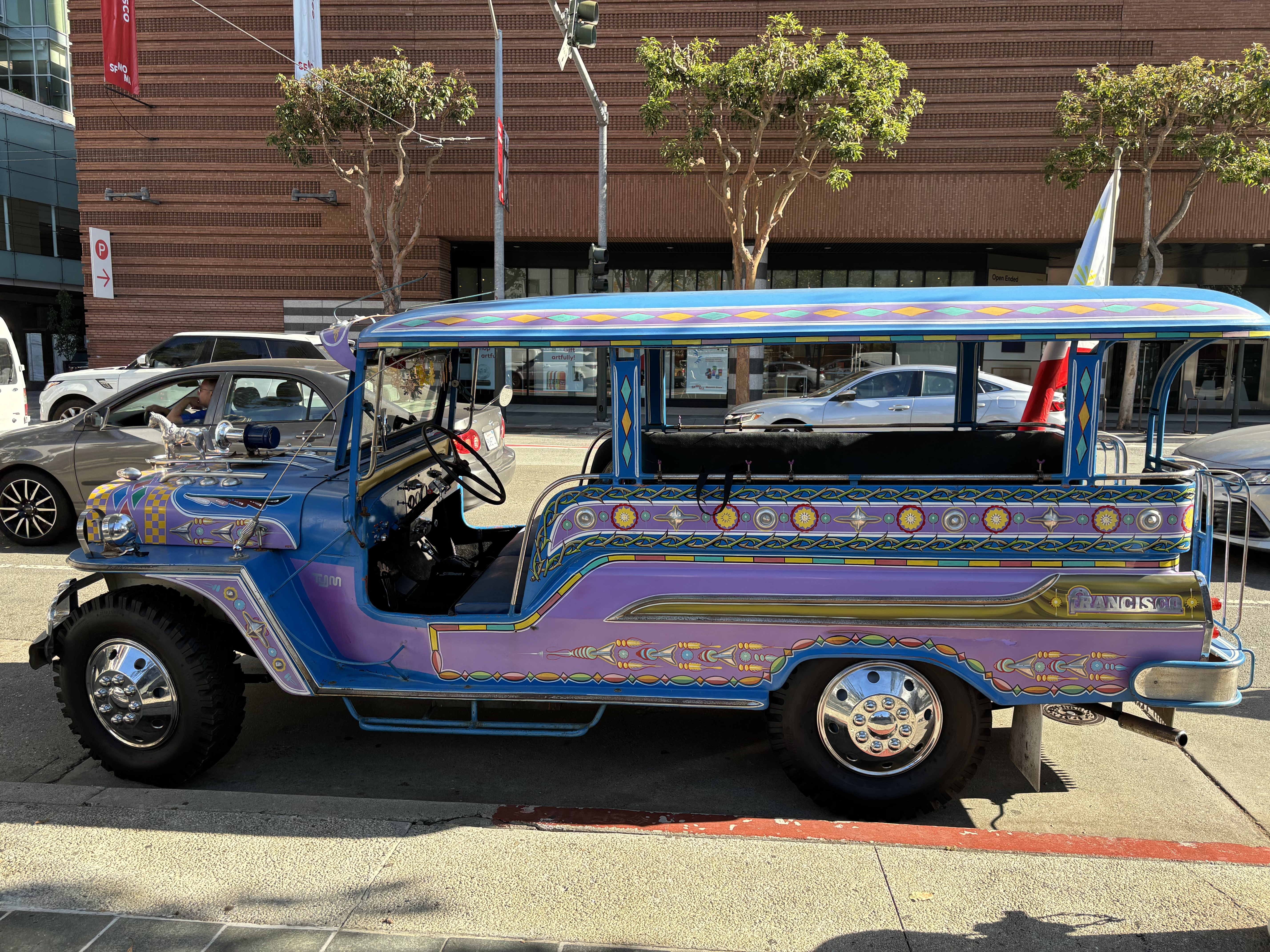 caption: This renovated jeepney, built in 1946, tours people around the Filipino Cultural District in San Francisco.